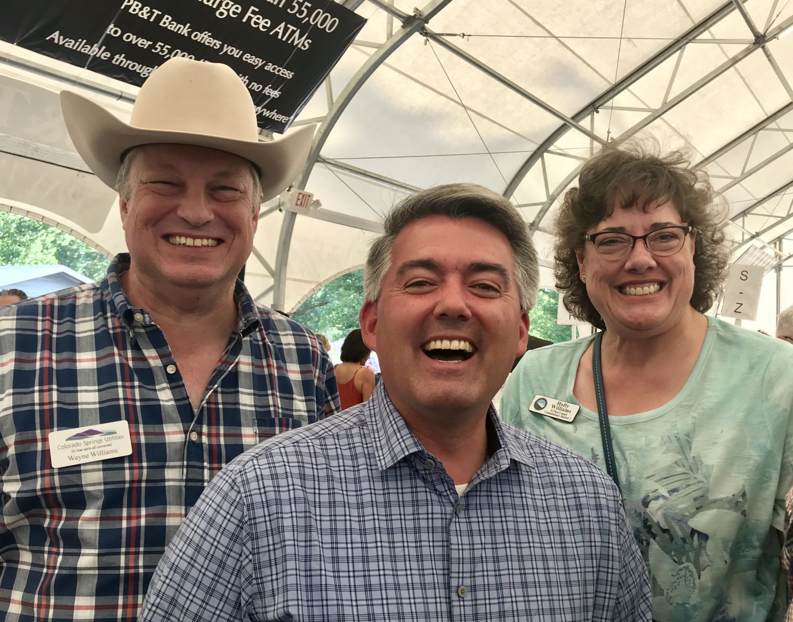 U.S. Sen. Cory Gardner is flanked by Colorado Springs Councilman Wayne Williams and his wife, El Paso County Commissioner Holly Williams